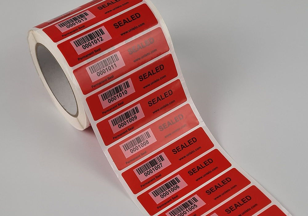 Unisto Multiseal permanent tamper-evident security labels on a roll in red