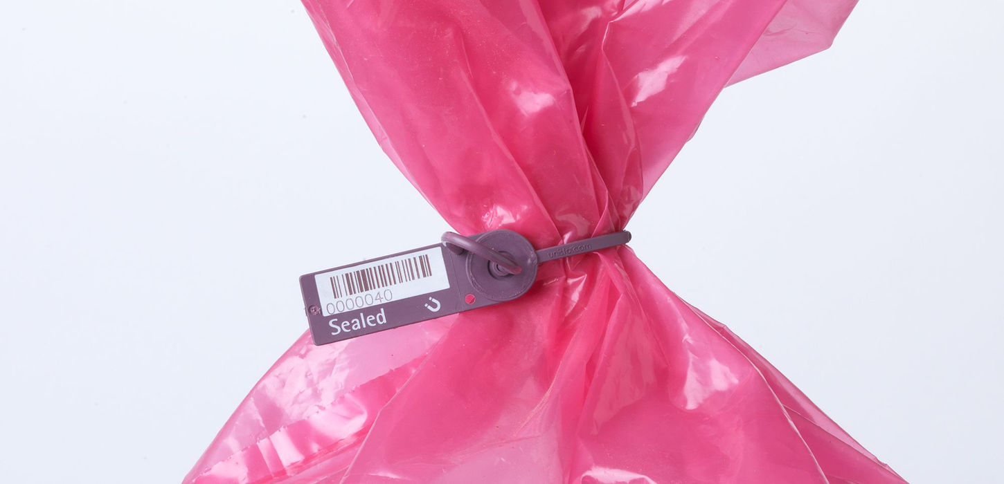 Unisto Medio Detect detectable pull-tight security seal applied to a plastic bag